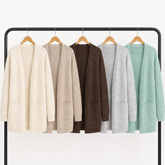Liora open-front cardigans in five colors on a clothing rail